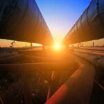 Saudi Oil Bypass Goes Dark Industrial pipelines at sunset
