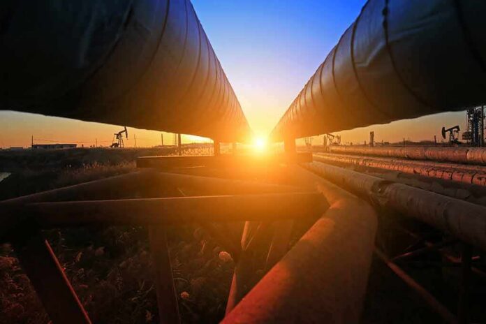 shutterstock_749826562 Industrial pipelines at sunset