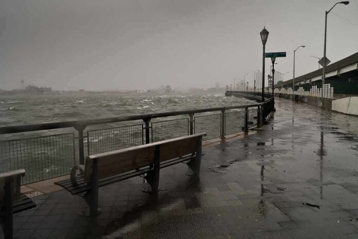 stormy waterfront promenade with benches and choppy water