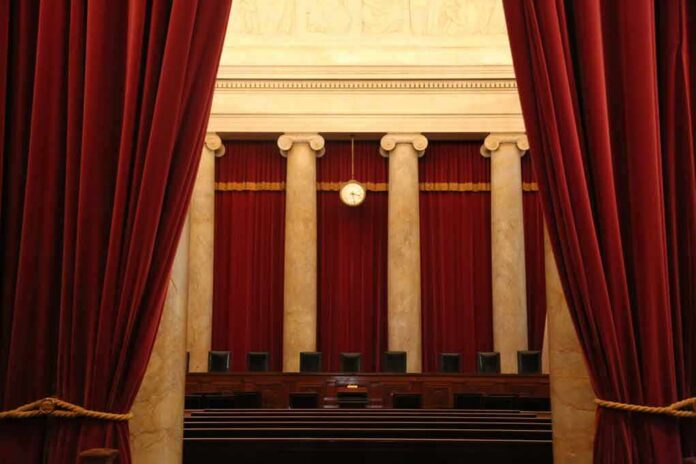 Courtroom with red curtains and marble columns