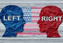 Blue and red paper head silhouettes facing each other over a faded U.S. flag