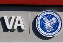 Veterans Caught In NYC Funding Crossfire VA logo and Department of Veterans Affairs seal on building wall