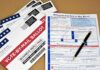 Vote-by-mail ballot envelopes and application form with pen