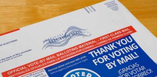 Mail-in ballot envelope with thank you message and I Voted sticker