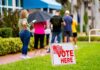 voters standing in line outside a polling place