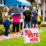 voters standing in line outside a polling place