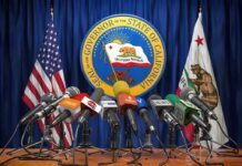 California Torches Disposable Vapes Press microphones at a podium before California governor seal