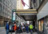 Andreas Hestler and pedestrians outside The Roosevelt Hotel entrance on a city sidewalk