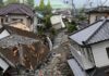 Earthquake-damaged residential street with collapsed houses
