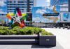 FBI Sting Stops Mall Massacre Plan Mall entrance with colorful star sculpture and mirrored facade