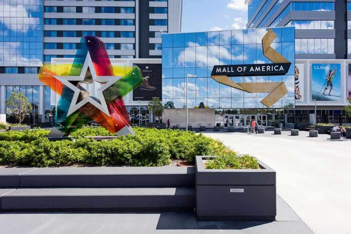 shutterstock_455150776 Mall entrance with colorful star sculpture and mirrored facade